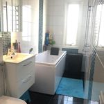 bathroom featuring tile flooring, natural light, and vanity