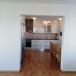kitchen featuring refrigerator, light hardwood flooring, white cabinetry, and dark countertops