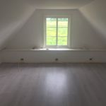 spare room with parquet floors and natural light