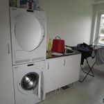laundry room featuring natural light, tile flooring, and independent washer and dryer