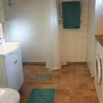 bathroom featuring tile floors, washer / dryer, and vanity