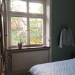 bedroom featuring natural light and radiator