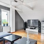 living room with beamed ceiling, hardwood floors, TV, radiator, and stainless steel finishes