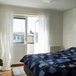 bedroom with natural light and radiator