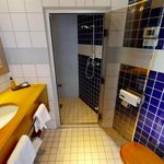 bathroom featuring tile floors, mirror, and vanity