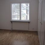 empty room with parquet floors and natural light