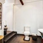 half bath featuring tile flooring, toilet, and vanity