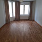 empty room with a healthy amount of sunlight and hardwood flooring