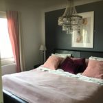 bedroom with a notable chandelier