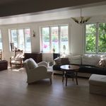 living room featuring plenty of natural light and hardwood floors