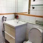 half bathroom featuring large vanity, toilet, and mirror