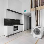 laundry room with tile flooring and oven