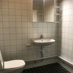 half bathroom featuring tile floors, washbasin, toilet, and mirror