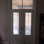 entryway featuring parquet floors and french doors