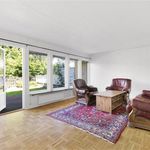living room with abundant sunlight and hardwood floors