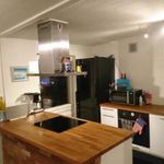 kitchen featuring dark brown cabinetry