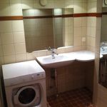 washroom with tile floors and washer / dryer