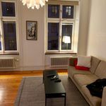 living room featuring hardwood flooring and radiator