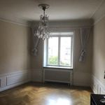 spare room with a chandelier, hardwood floors, natural light, and radiator