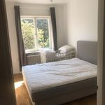 bedroom with natural light and radiator