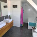 bathroom featuring tile floors, mirror, and washbasin