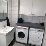 laundry room featuring tile flooring and separate washer and dryer
