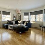 living room with a wealth of natural light and hardwood flooring
