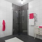 bathroom featuring tile flooring, vanity, and shower with shower door