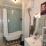 bathroom featuring tile floors, shower curtain, vanity, and bath / shower combination