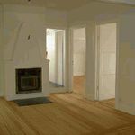 empty room featuring a fireplace and hardwood floors