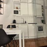 kitchen featuring range oven, dishwasher, refrigerator, microwave, light countertops, white cabinetry, and dark hardwood flooring