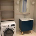 washroom with carpet and washer / dryer
