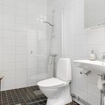 full bathroom with tile floors, mirror, toilet, shower cabin, and washbasin