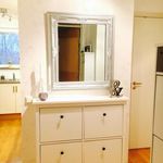 bathroom featuring large vanity and mirror