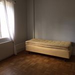 bedroom featuring hardwood floors, natural light, and radiator