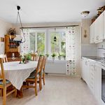carpeted dining space with natural light and range oven