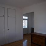 spare room featuring natural light and hardwood flooring