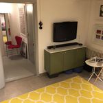 corridor featuring tile flooring and TV