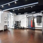 gym with natural light and hardwood floors