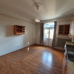 empty room featuring natural light and hardwood flooring