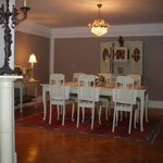 dining area featuring hardwood floors and a notable chandelier