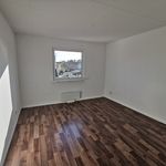 empty room with natural light and hardwood flooring