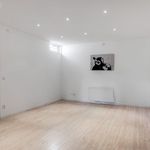 empty room with parquet floors and natural light