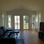 living room featuring plenty of natural light and hardwood floors
