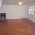 empty room featuring hardwood flooring and radiator