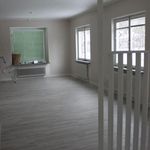 spare room featuring a healthy amount of sunlight and hardwood floors